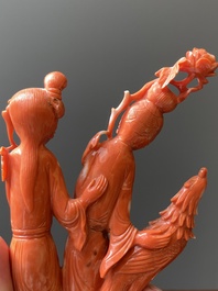 A Chinese red coral group of two ladies and a phoenix, 19/20th C.