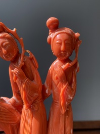 A Chinese red coral group of two ladies and a phoenix, 19/20th C.