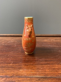 A small Chinese coral-ground 'hu' vase with gilt 'dragon and phoenix' design, Qianlong mark, Qing