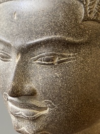 A Khmer polished sandstone head of Uma in Baphuon-style, Angkor period, Cambodia, 11th C.