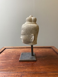 A Khmer polished sandstone head of Uma in Baphuon-style, Angkor period, Cambodia, 11th C.