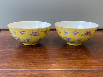 A pair of Chinese famille rose yellow-ground 'butterfly' bowls, Tongzhi mark and of the period