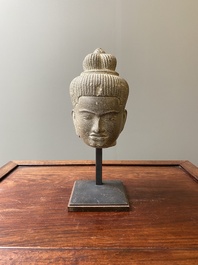 A Khmer polished sandstone head of Uma in Baphuon-style, Angkor period, Cambodia, 11th C.