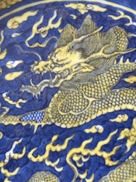 A Chinese blue-ground yellow-enamelled 'dragon' dish, Qianlong mark and of the period