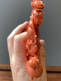 A Chinese red coral group of two ladies and a phoenix, 19/20th C.