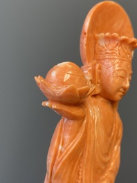 A Chinese red coral figure of a standing Bodhisattva with two dragons, 19/20th C.