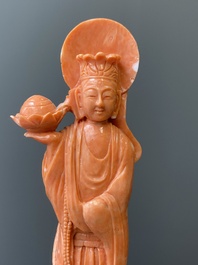 A Chinese red coral figure of a standing Bodhisattva with two dragons, 19/20th C.