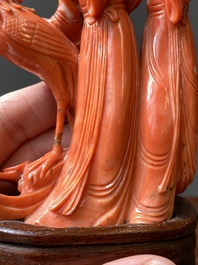 A Chinese red coral group of two ladies and a phoenix, 19/20th C.