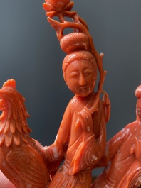 A Chinese red coral group of two ladies and a phoenix, 19/20th C.