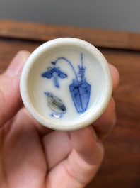 Four Chinese blue, white and copper-red snuff bottles, 19th C.