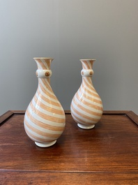 A rare pair of Chinese bottle vases with iron-red design in the style of Venetian glass, Kangxi
