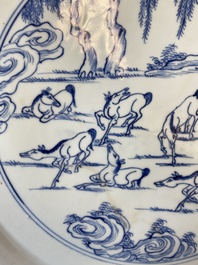 A Chinese blue and white 'Eight horses of Mu Wang' dish with silver-mounted rim, Kangxi/Yongzheng