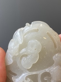 A Chinese white jade paper weight with a crane and a tiger, 17/18th C.