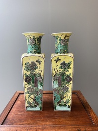 A pair of Chinese square yellow-ground famille verte vases, Kangxi mark, 19th C.