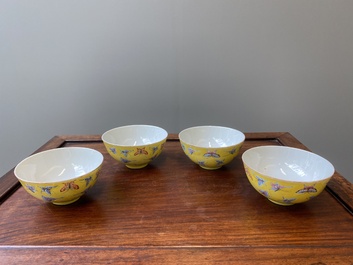 Four Chinese famille rose yellow-ground 'butterfly' bowls, Tongzhi mark and of the period