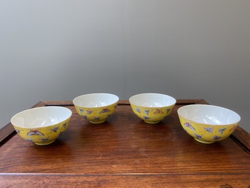 Four Chinese famille rose yellow-ground 'butterfly' bowls, Tongzhi mark and of the period