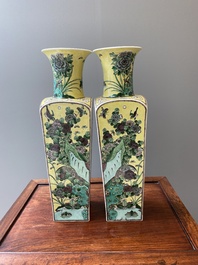 A pair of Chinese square yellow-ground famille verte vases, Kangxi mark, 19th C.