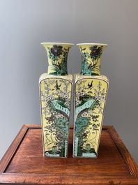 A pair of Chinese square yellow-ground famille verte vases, Kangxi mark, 19th C.