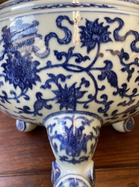 A large Chinese blue and white 'bajixiang' tripod censer with lotus scrolls, Qianlong