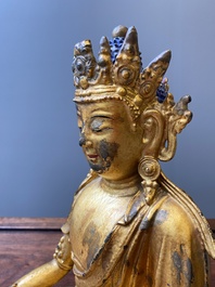 A fine Chinese gilt bronze sculpture of Shakyamuni Buddha, 15/16th C.