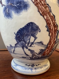 A Chinese blue, white and copper-red vase with two deer near a pine tree, Qianlong