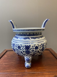 A large Chinese blue and white 'bajixiang' tripod censer with lotus scrolls, Qianlong