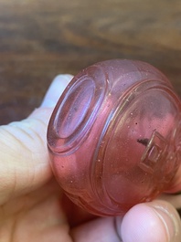 A Chinese ruby-pink glass 'bats' snuff bottle, Qianlong mark and of the period