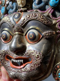 A fine large semi-precious-stone-inlaid filigree silver 'Bhairava' mask, Tibet or Nepal, 19th C.