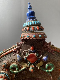 A fine large semi-precious-stone-inlaid filigree silver 'Bhairava' mask, Tibet or Nepal, 19th C.