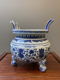 A large Chinese blue and white 'bajixiang' tripod censer with lotus scrolls, Qianlong