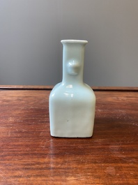 A small Chinese celadon-ground blue, white and copper-red bottle vase, Qianlong mark and of the period