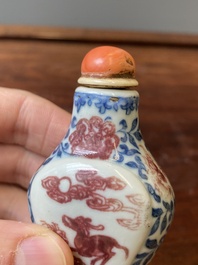 A Chinese blue, white and copper-red snuff bottle, Yongzheng mark and of the period