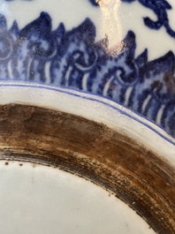 A large Chinese blue and white 'bajixiang' tripod censer with lotus scrolls, Qianlong