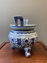 A large Chinese blue and white 'bajixiang' tripod censer with lotus scrolls, Qianlong