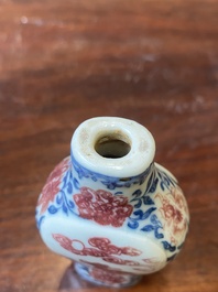 A Chinese blue, white and copper-red snuff bottle, Yongzheng mark and of the period