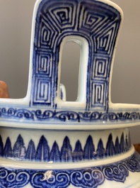 A large Chinese blue and white 'bajixiang' tripod censer with lotus scrolls, Qianlong