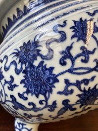 A large Chinese blue and white 'bajixiang' tripod censer with lotus scrolls, Qianlong