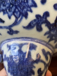 A large Chinese blue and white 'bajixiang' tripod censer with lotus scrolls, Qianlong