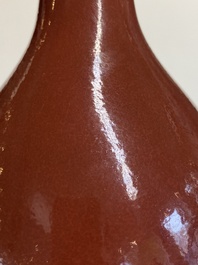 A Chinese monochrome dark ruby-red-glazed bottle vase, Qianlong mark and of the period