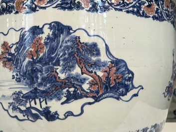 An exceptional massive Chinese blue, white and copper-red fish bowl with antiquities and 'Master of the rocks'-style panels, Kangxi