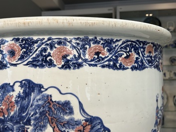 An exceptional massive Chinese blue, white and copper-red fish bowl with antiquities and 'Master of the rocks'-style panels, Kangxi