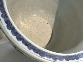 An exceptional massive Chinese blue, white and copper-red fish bowl with antiquities and 'Master of the rocks'-style panels, Kangxi