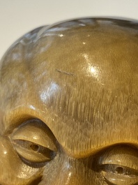 A rare Chinese rhinoceros horn sculpture of Buddha, 19th C.
