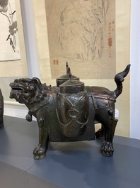 A large Chinese bronze 'touhu' or arrow vase in the shape of a lion, Ming