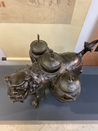 A large Chinese bronze 'touhu' or arrow vase in the shape of a lion, Ming