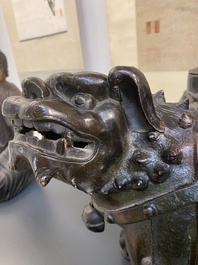A large Chinese bronze 'touhu' or arrow vase in the shape of a lion, Ming