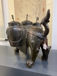 A large Chinese bronze 'touhu' or arrow vase in the shape of a lion, Ming