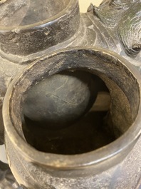 A large Chinese bronze 'touhu' or arrow vase in the shape of a lion, Ming