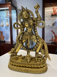 A Tibetan gilt bronze sculpture of Sarvabuddha Dakini, probably 15th C.
