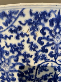 An exceptionally large Chinese blue and white basin with floral scrolls, Kangxi